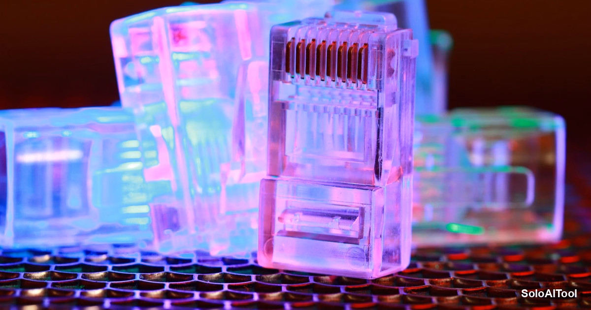 Glowing translucent network cable connectors lit in pink, blue and green light